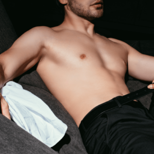 a man lying down on a couch. Somebody is opening his belt. Locktober - Keuschheit im Oktober Locktober - Chastity in October