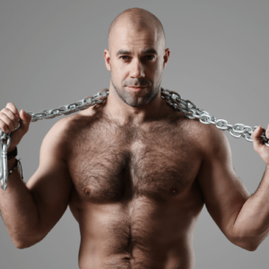 Pleasure Dome Symbolbild: Mann mit freiem Oberkörper und Ketten / Symbolic image: Man with bare upper body and chains