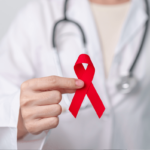 HIV Heilung Symbolbild: Aids-Schleife. Englisch: HIV cure Symbolic image: Aids ribbon.